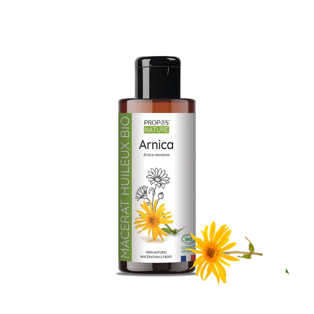 A bottle of Propos Nature Arnica Macerate Oil with a black cap and white label, shown on a white background with a yellow Arnica flower graphic.