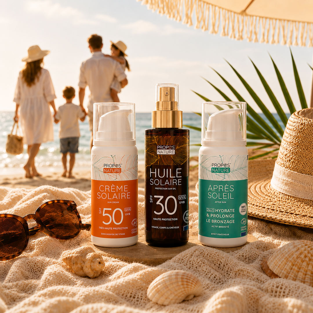 Sunscreen products on a beach with a family in the background