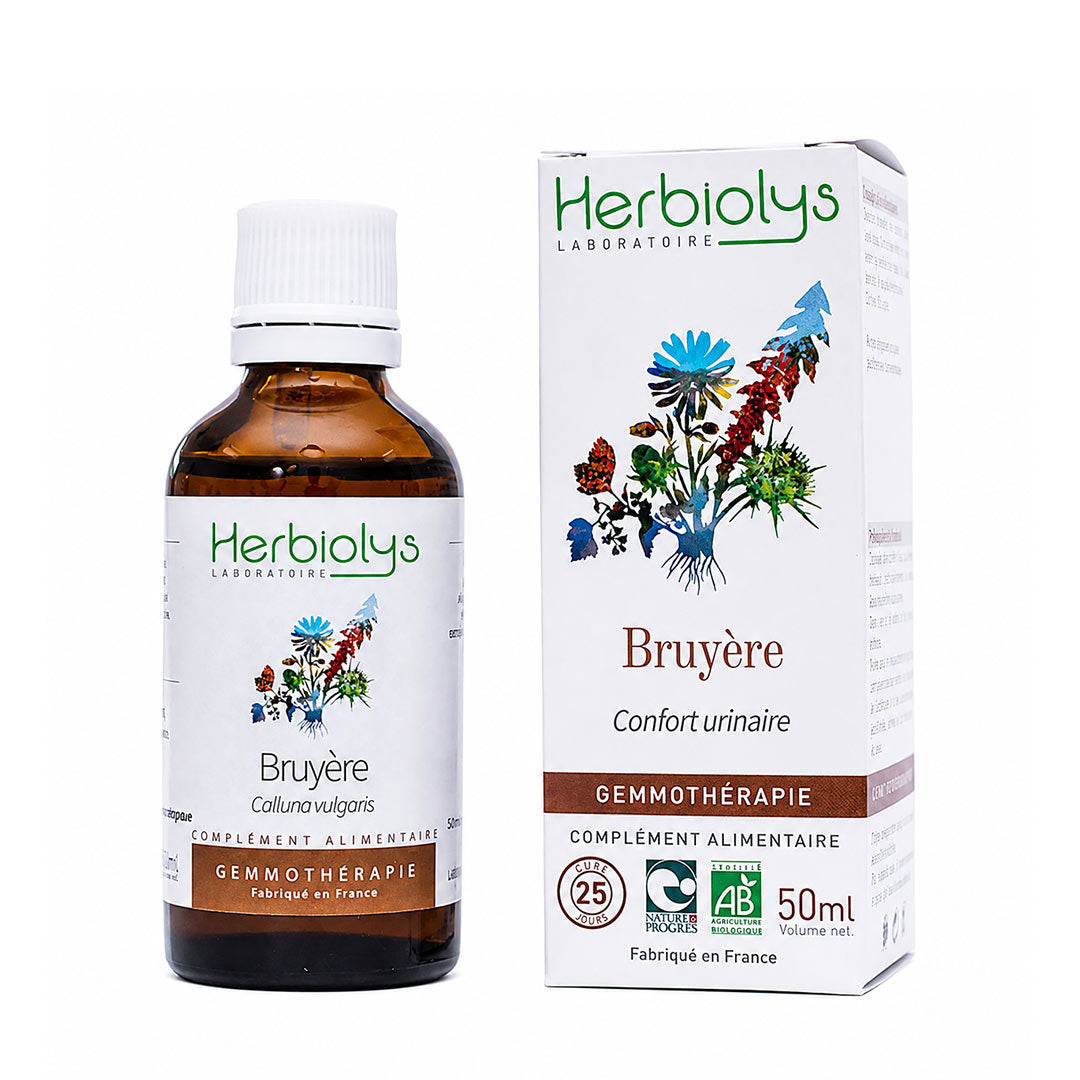 A bottle of Herbiolys Laboratoire Heather gemmotherapy supplement next to its white product box, featuring botanical illustrations and French text, on a white background.