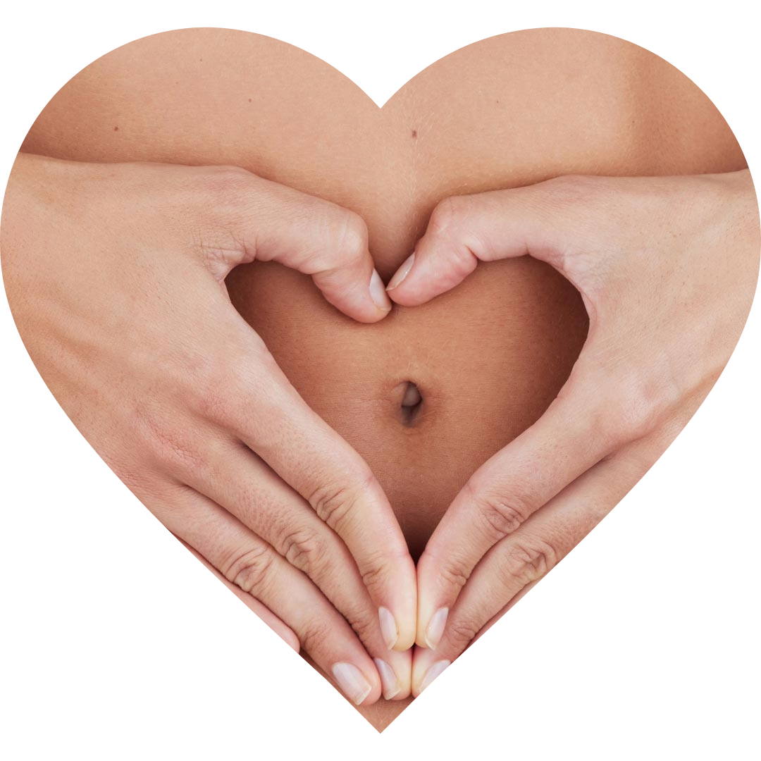 Woman heart hands on tummy